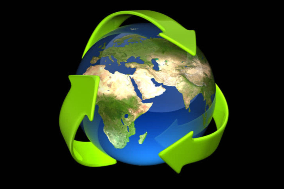 Earth wrapped in green recycling arrows symbolizing the real meaning behind refurbished technology